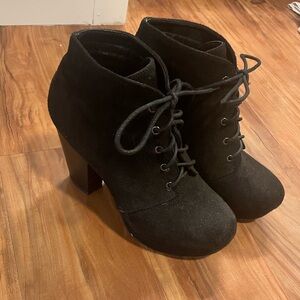 Black 3”-heeled suede booties with laces